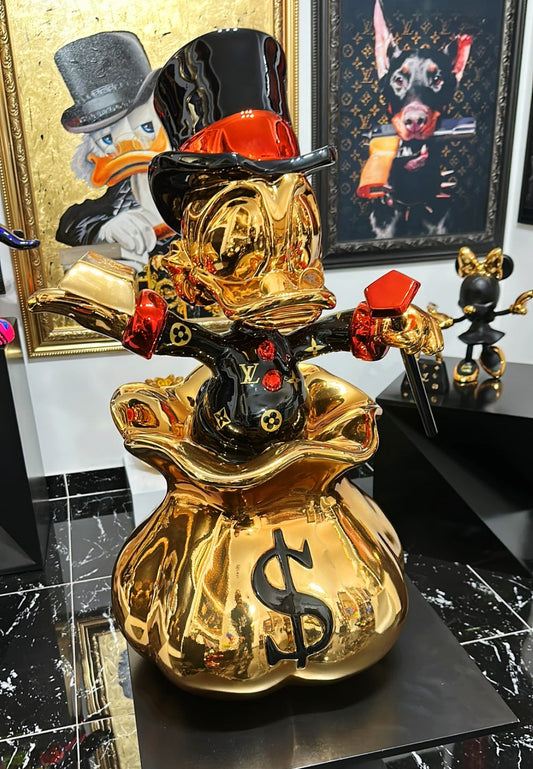 GOLDEN NEST EGG: THE DONALD DUCK MONEY BAG SCULPTURE